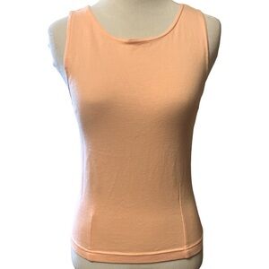 SO brand light peach colored tank top that is form fitted with seams